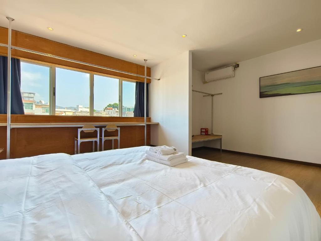 Postel nebo postele na pokoji v ubytování West Street Hills Travel B&B