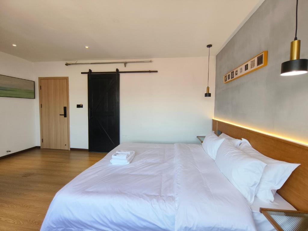 Postel nebo postele na pokoji v ubytování West Street Hills Travel B&B