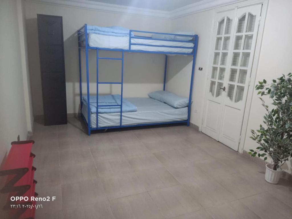 a room with two bunk beds in a room at AFB Hostel in Alexandria