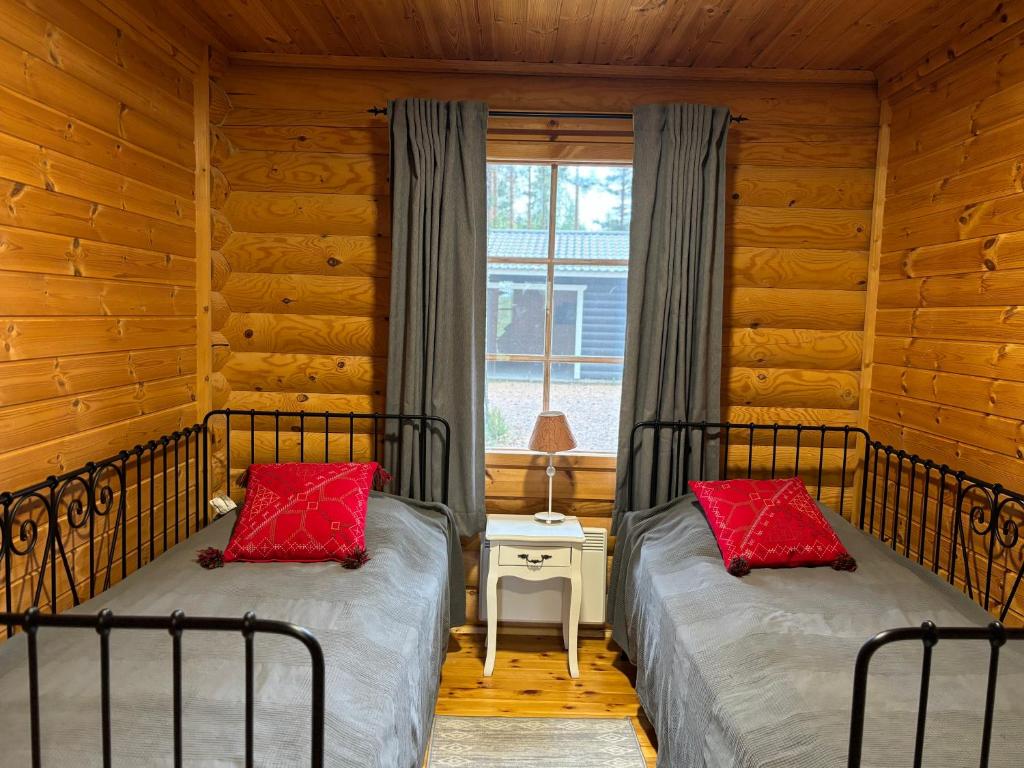 Postel nebo postele na pokoji v ubytování Villa Norppa