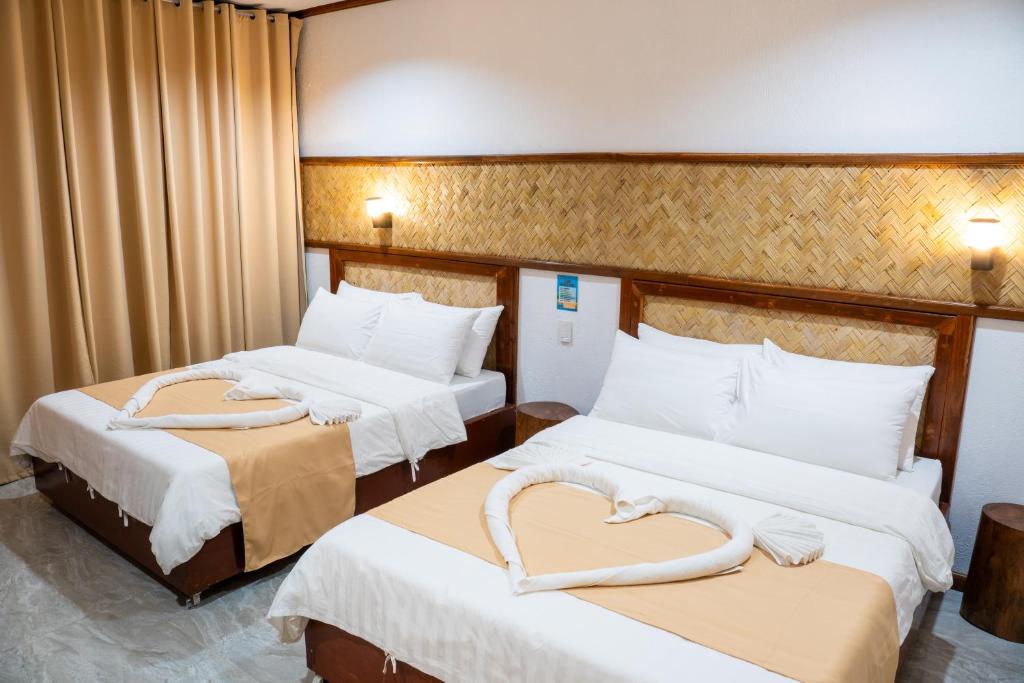 Katil atau katil-katil dalam bilik di El Nido Viewdeck Cottages