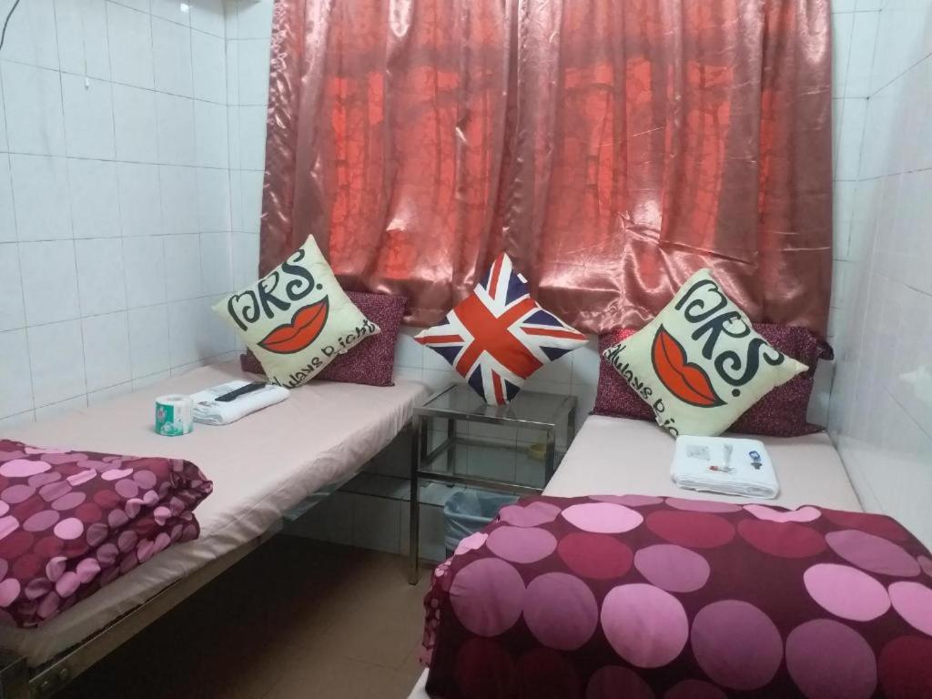 Postel nebo postele na pokoji v ubytování Manhattan Guesthouse