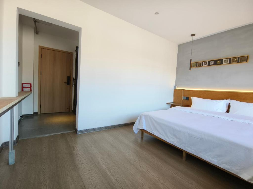 Postel nebo postele na pokoji v ubytování West Street Hills Travel B&B
