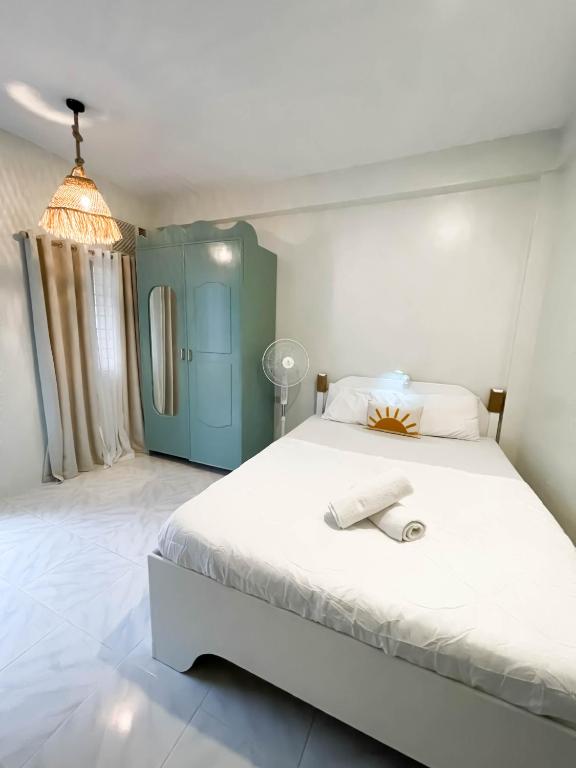 Voodi või voodid majutusasutuse Caleo Boracay Island Station 3 toas