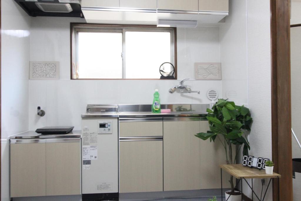Kuchyň nebo kuchyňský kout v ubytování Hotel LUANA in Shin-Nakano