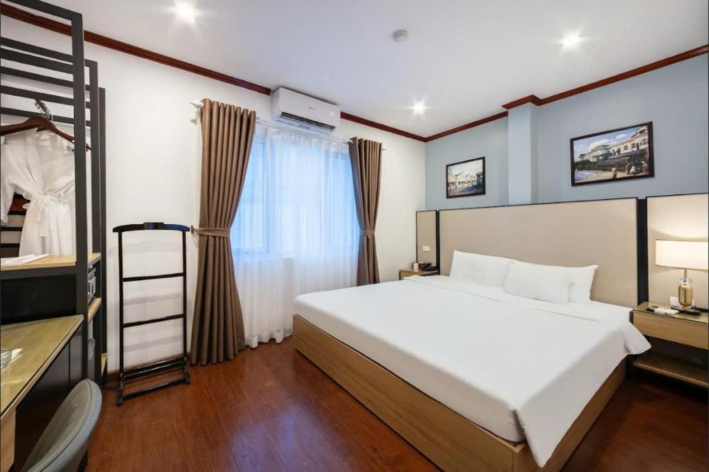 Postel nebo postele na pokoji v ubytování A25 Hotel - 30 An Dương