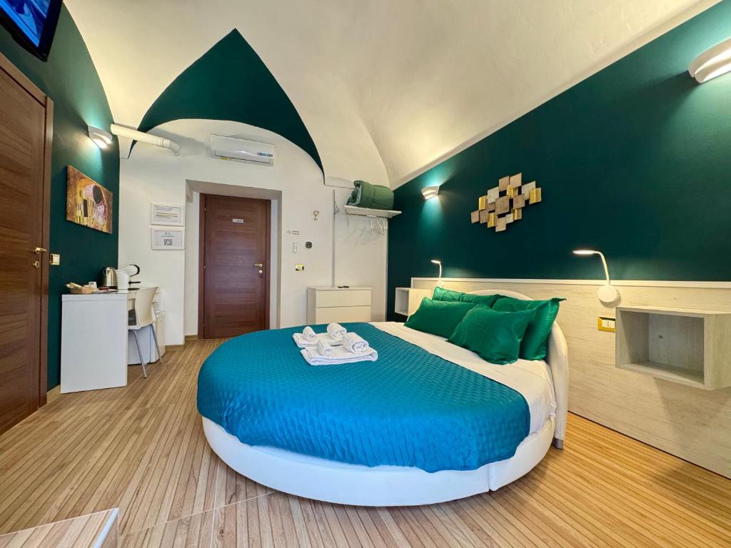 Postel nebo postele na pokoji v ubytování CANTU' SUITE