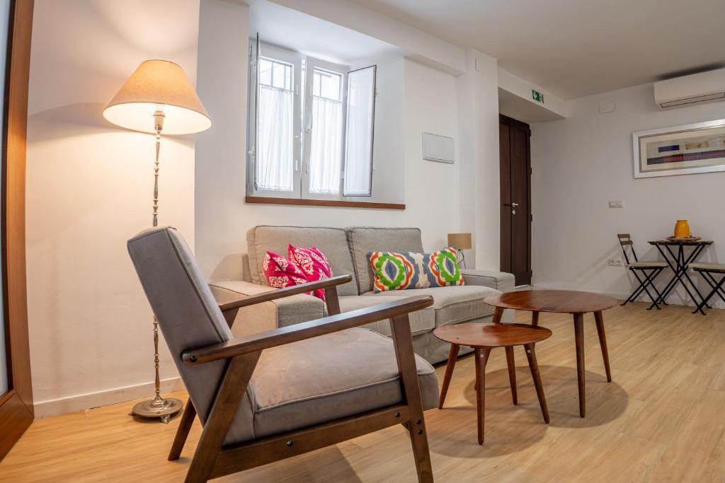 a living room with a couch and a table at Bamba Apartment Aracena-ONLY ADULTS in Aracena