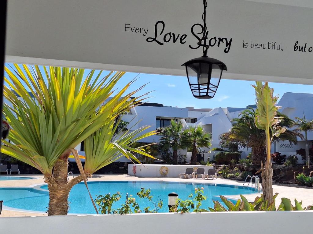 a view of the pool at the love story resort at Fuerte Confort in La Oliva