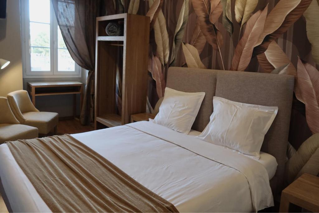 Postel nebo postele na pokoji v ubytování Hotel De La Mer