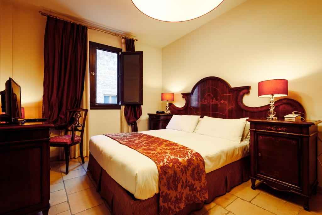 Postel nebo postele na pokoji v ubytování Vico Regio Hotel