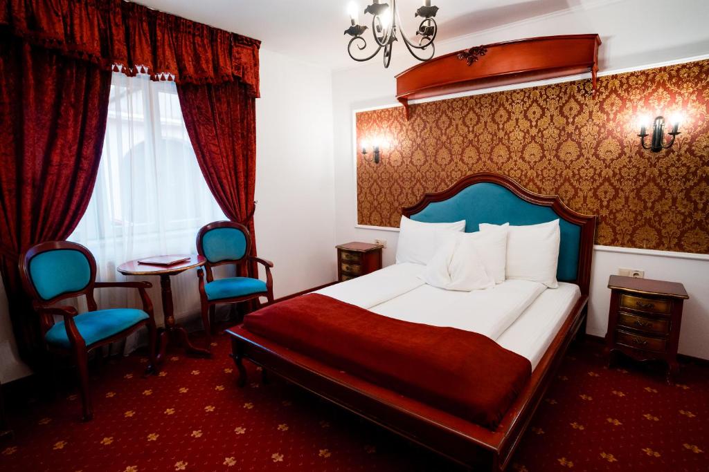 Postel nebo postele na pokoji v ubytování Rosen Villa Sibiu