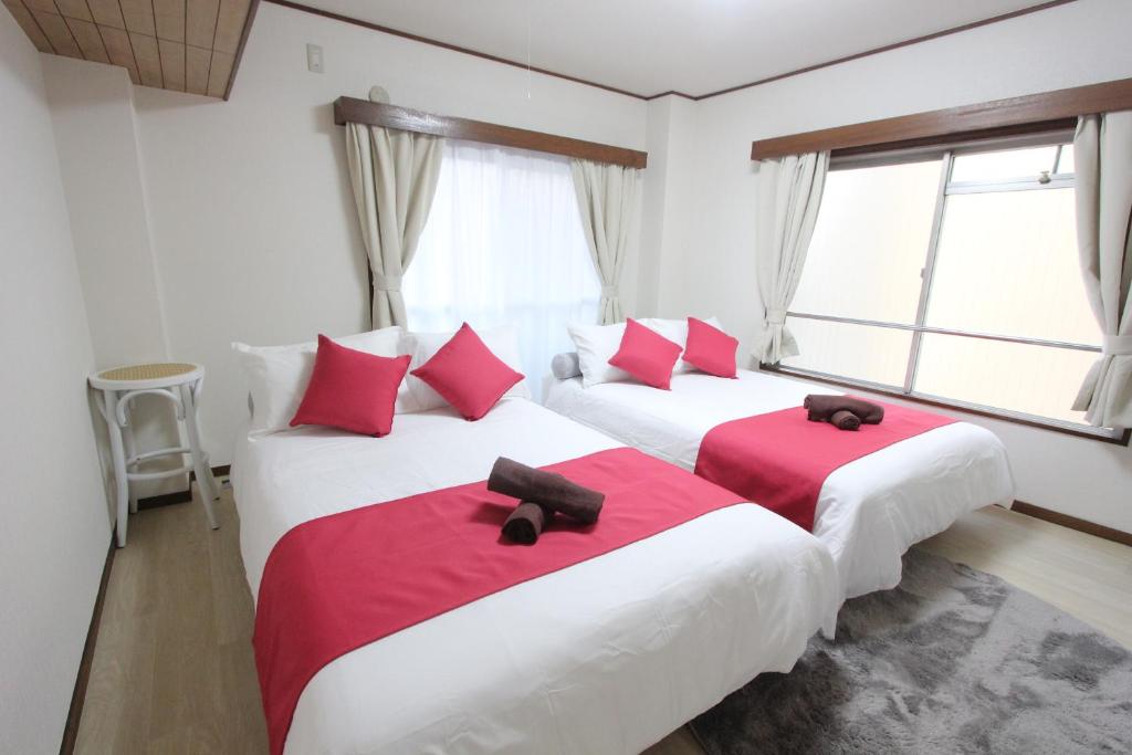 Postel nebo postele na pokoji v ubytování Hotel LUANA in Shin-Nakano