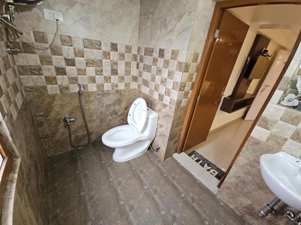 Koupelna v ubytování R R K Residency