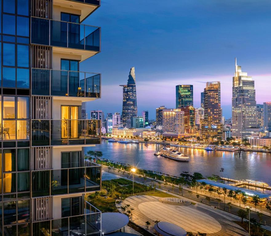 a view of the city skyline at night at The Metropole Opera Residence by KayStay in Ho Chi Minh City