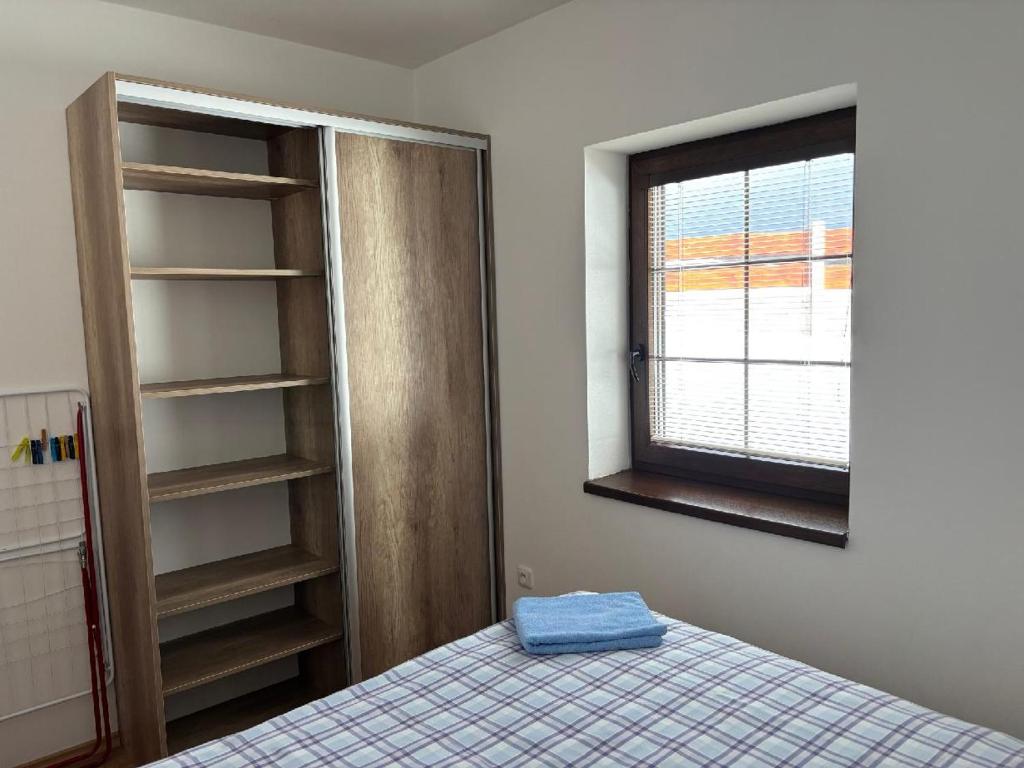 Postel nebo postele na pokoji v ubytování Apartmán u Hovorků