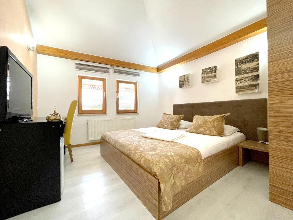 Postel nebo postele na pokoji v ubytování Hotel Kovači