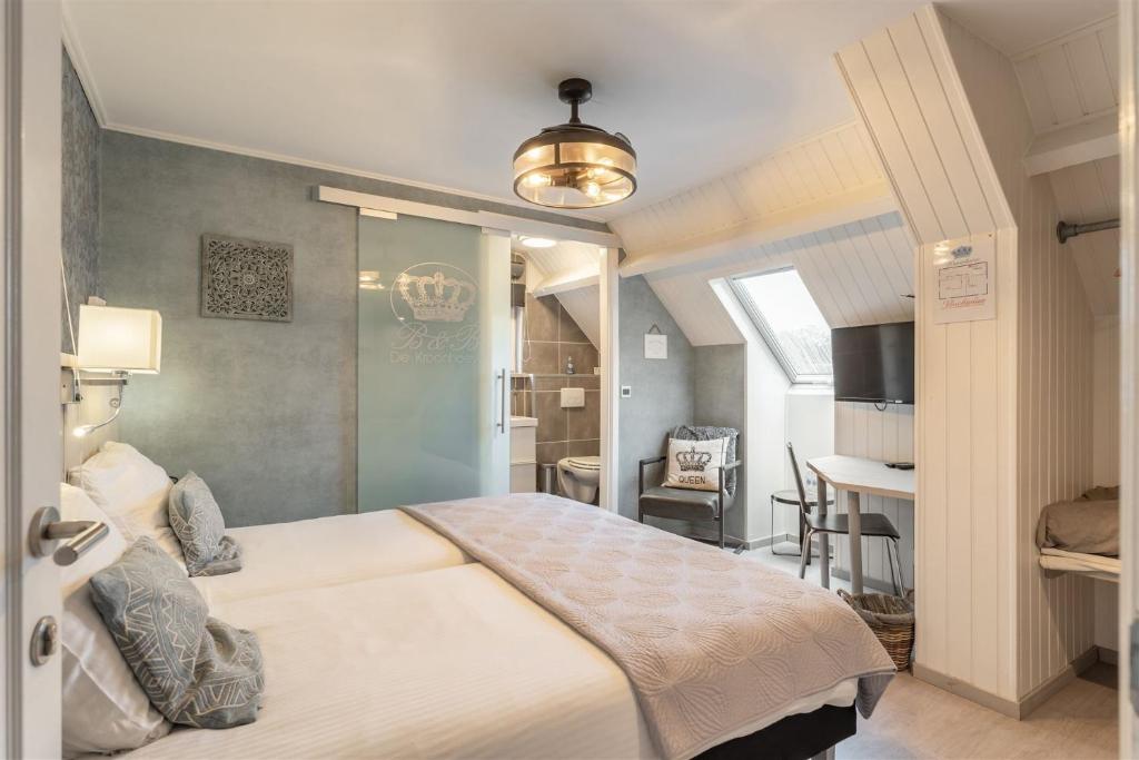 Postel nebo postele na pokoji v ubytování B&B De Kroonhoeve