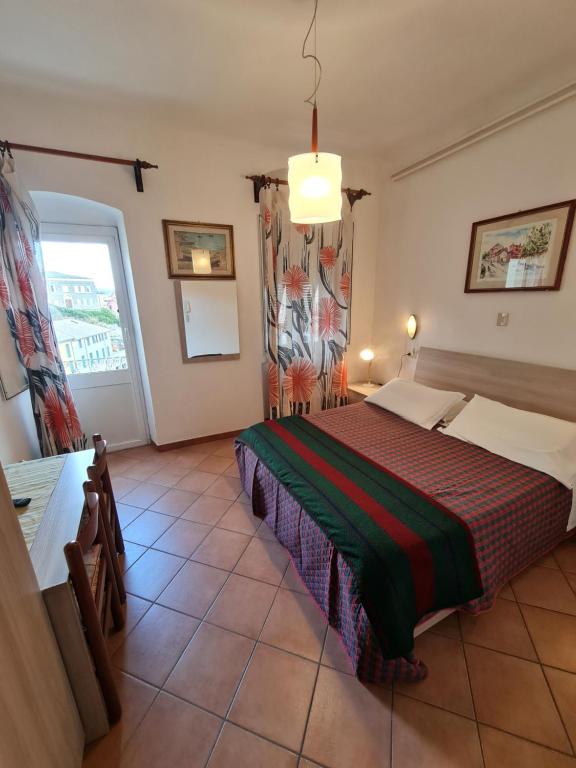 Postel nebo postele na pokoji v ubytování Albergo Genio