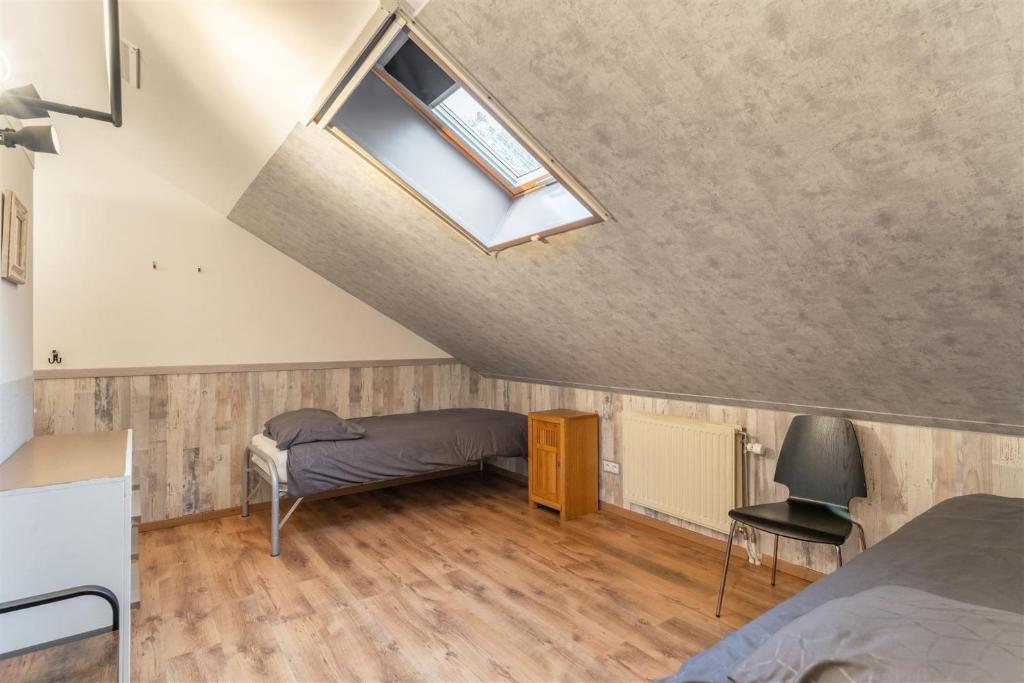 Postel nebo postele na pokoji v ubytování B&B De Kroonhoeve