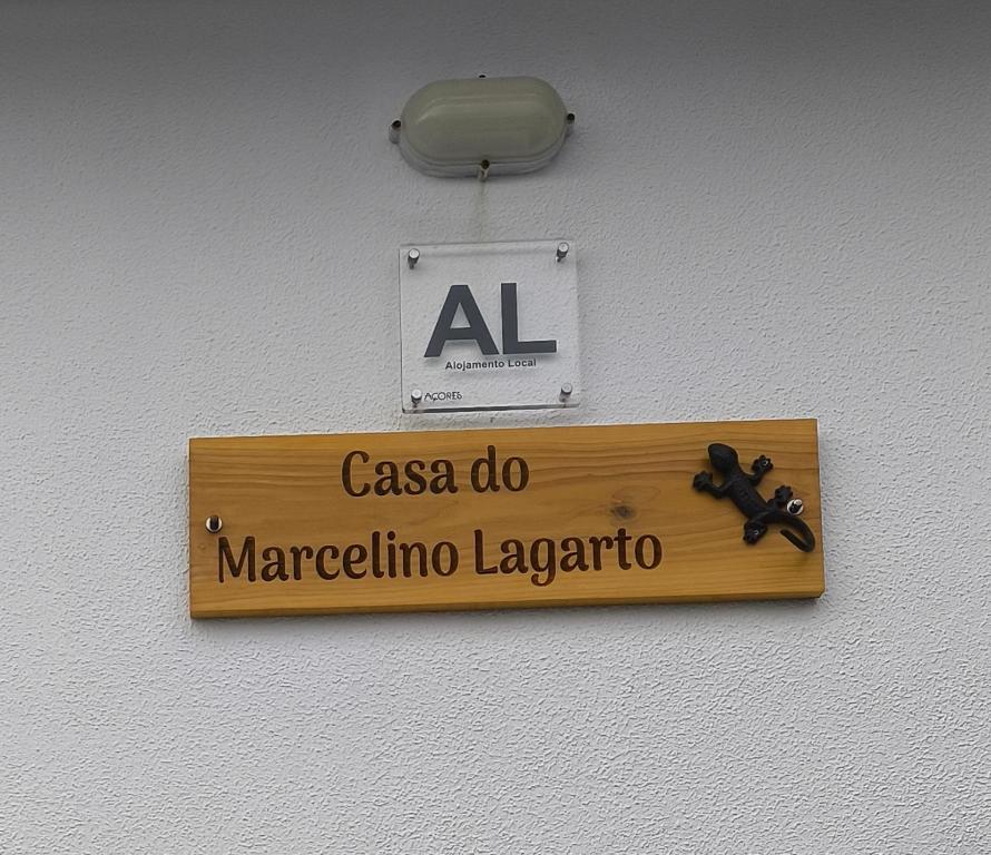 a sign on a wall that reads marceline laboratory at Casa do Marcelino Lagarto in São Roque do Pico