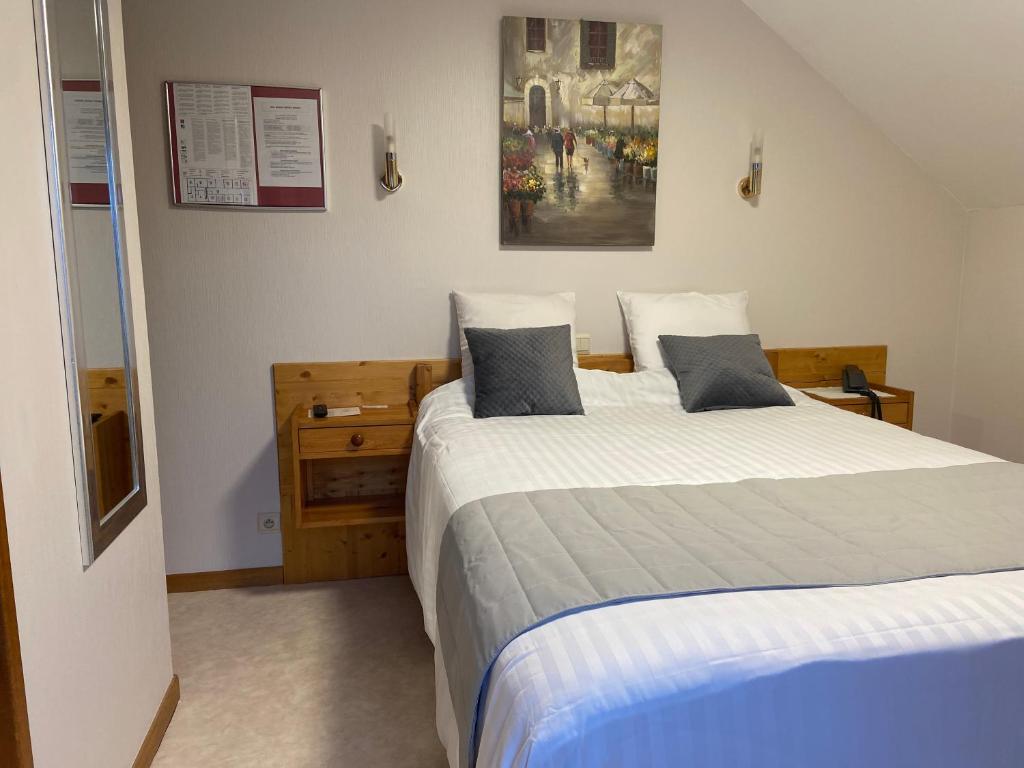 Postel nebo postele na pokoji v ubytování Hotel Beau Site