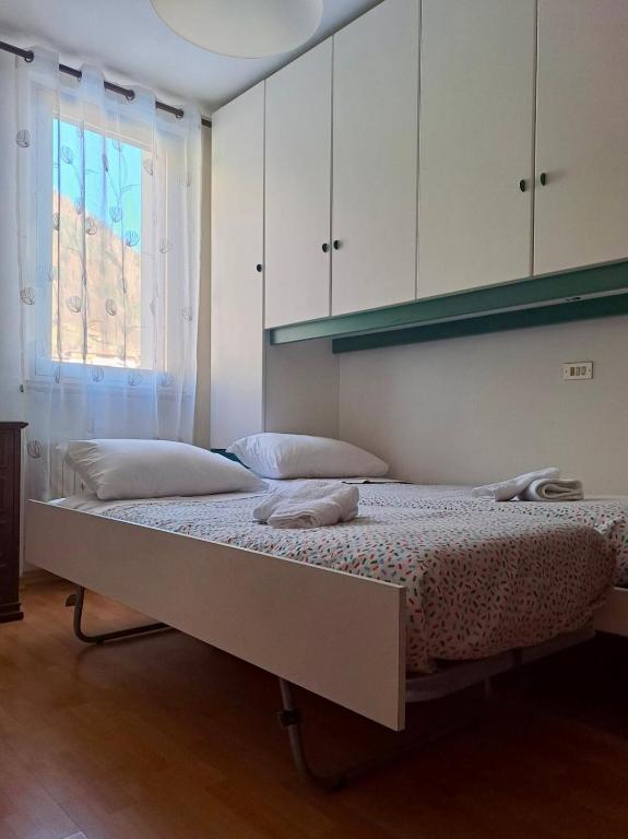 Postel nebo postele na pokoji v ubytování Appartamento A Càsa dei Nòni