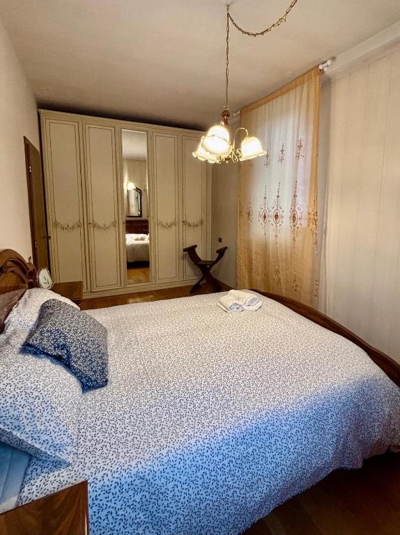 Postel nebo postele na pokoji v ubytování Appartamento A Càsa dei Nòni