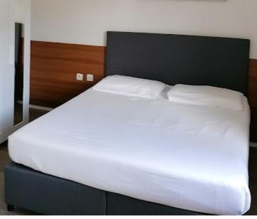 Vuode tai vuoteita majoituspaikassa Hotel Gamper