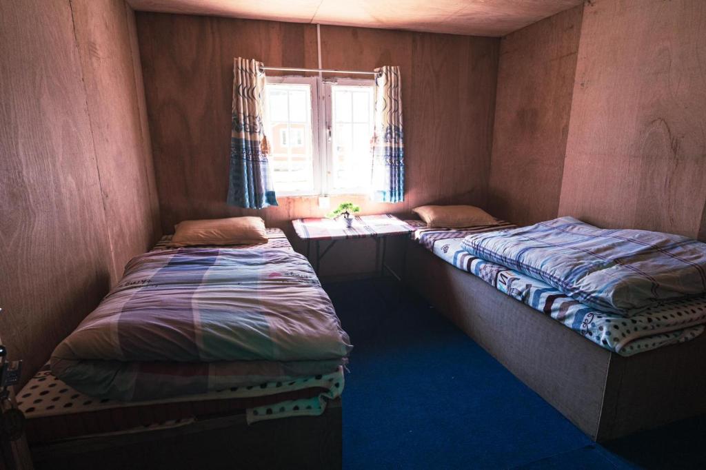 Postel nebo postele na pokoji v ubytování Amadablam Base Camp Lodge