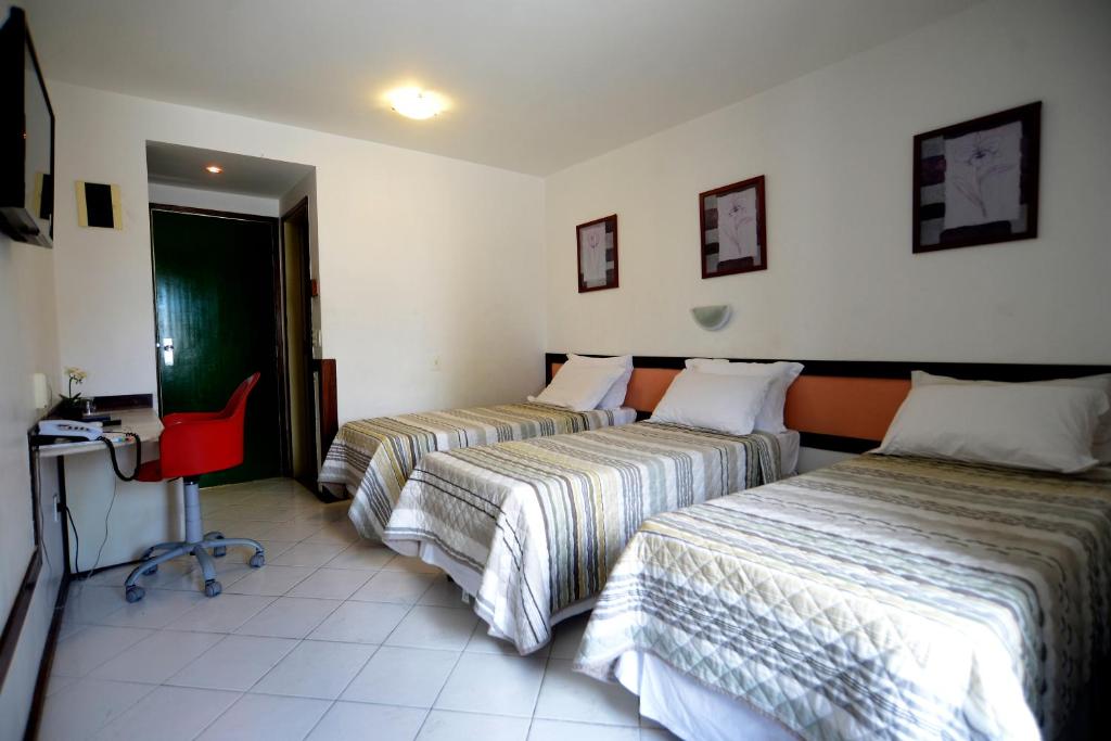 Postel nebo postele na pokoji v ubytování Rede Andrade Mar Hotel - Rio Vermelho