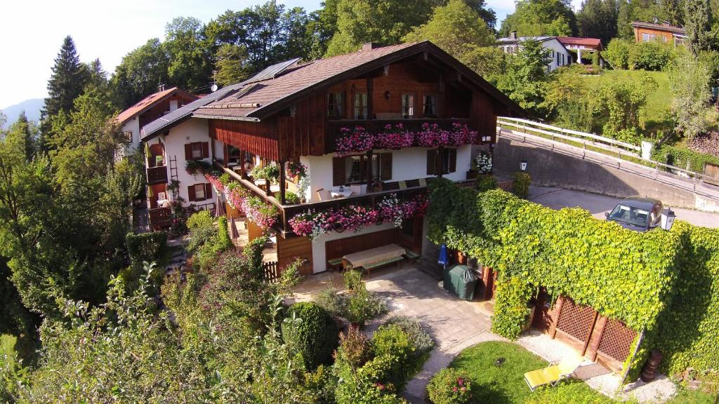 an aerial view of a house with ivy at Gästehaus Sonnenbichl in Fischbachau