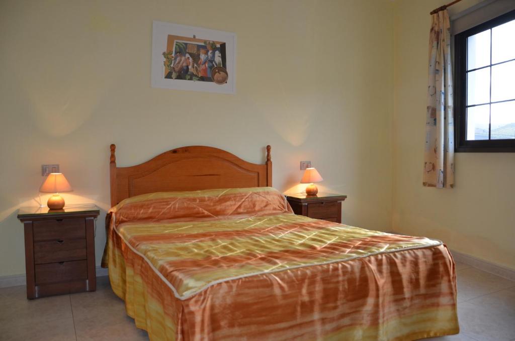 Posteľ alebo postele v izbe v ubytovaní Casa la Ermita