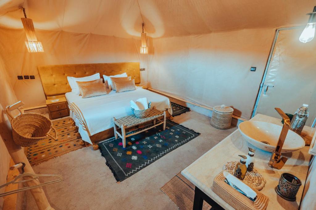 Postel nebo postele na pokoji v ubytování Kidal Camp