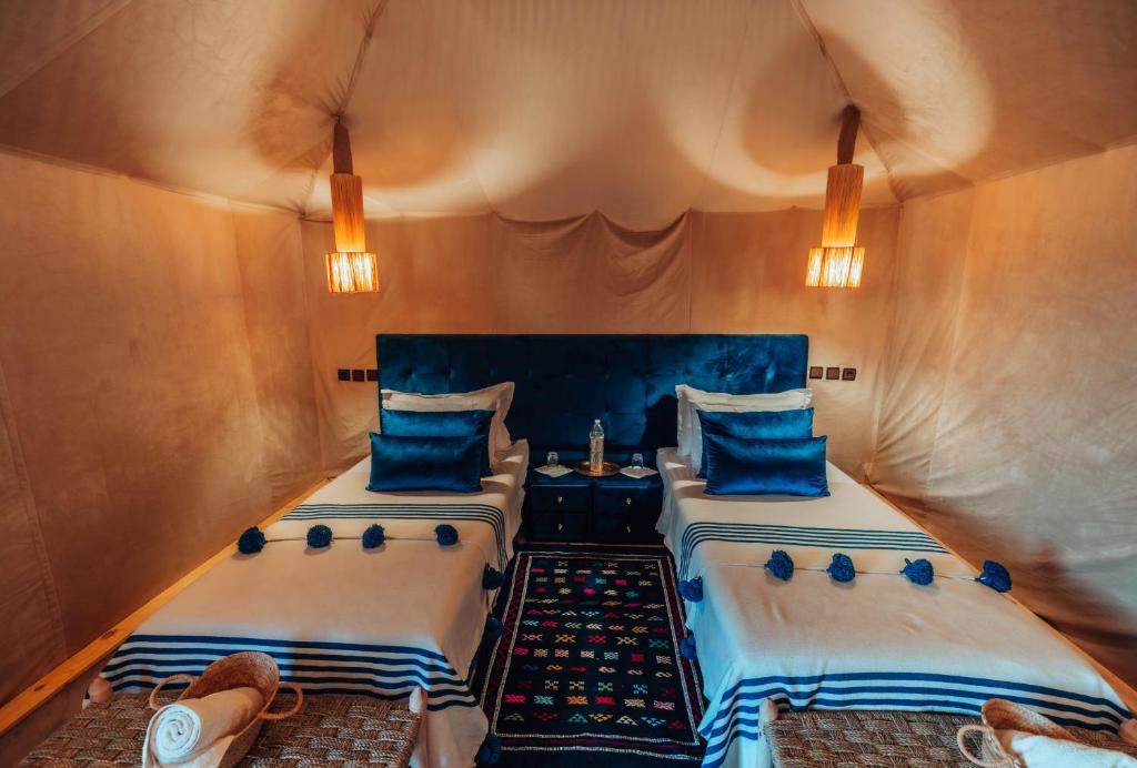 Postel nebo postele na pokoji v ubytování Kidal Camp