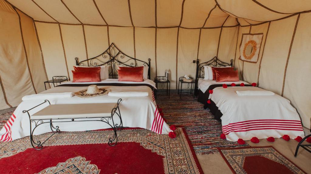 Postel nebo postele na pokoji v ubytování Kidal Camp