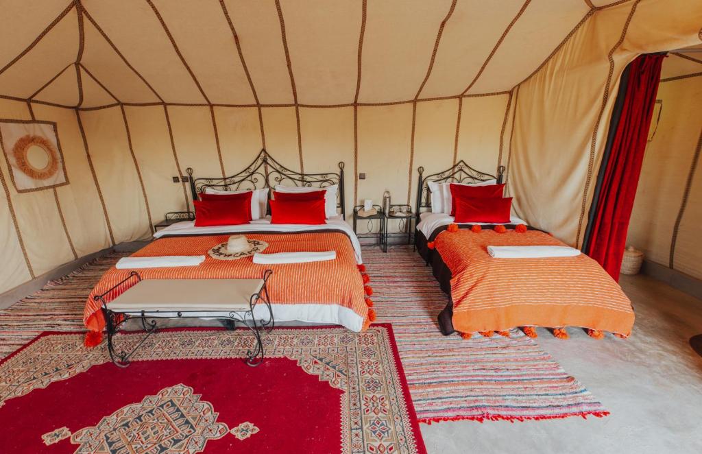 Postel nebo postele na pokoji v ubytování Kidal Camp