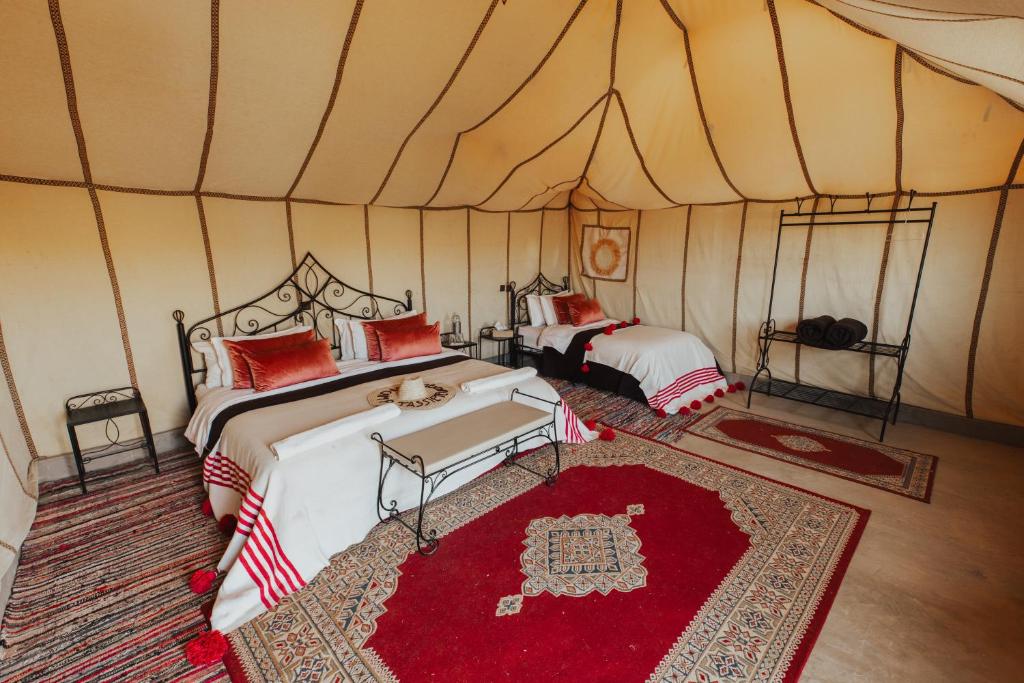 Postel nebo postele na pokoji v ubytování Kidal Camp