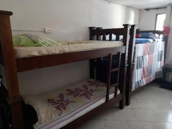 Postel nebo postele na pokoji v ubytování Casablanca Hostel Cali B&B