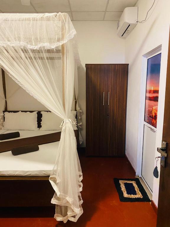 Postel nebo postele na pokoji v ubytování Perfect Home Mirissa