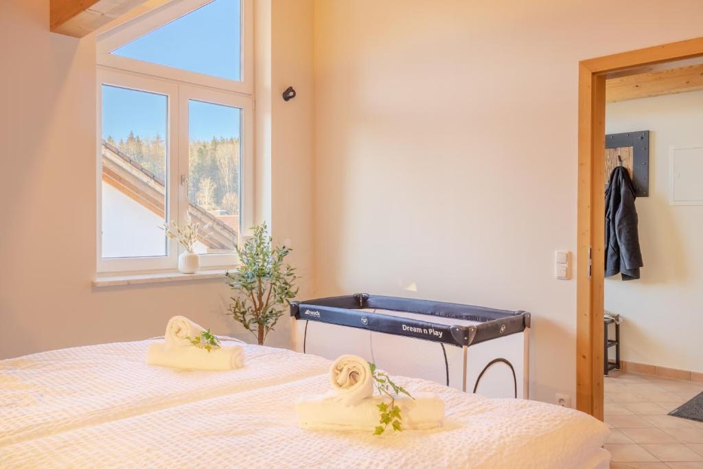 Letto o letti in una camera di Helle Wohnung mit Seeblick