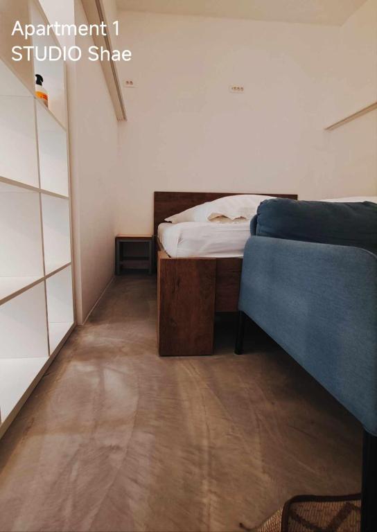 Postel nebo postele na pokoji v ubytování Pekarna apartments