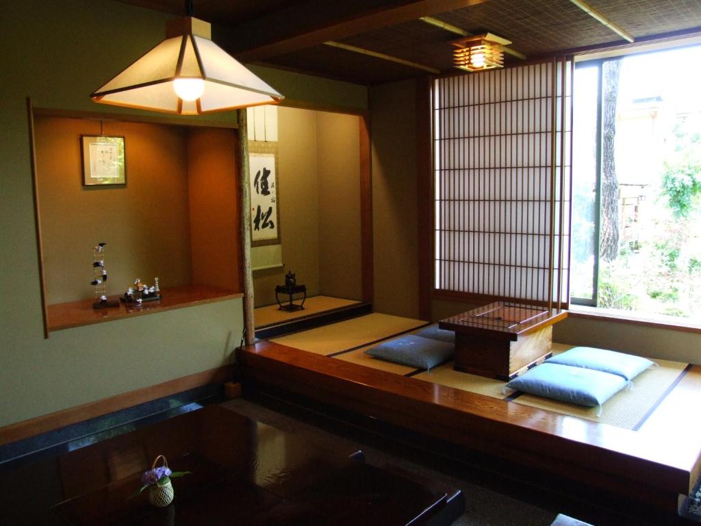 a room with a room with a mirror and a room with sidx sidx sidx sidx at Yoshimatsu in Hakone