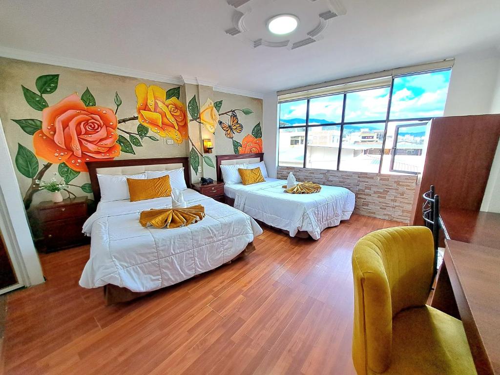 Postel nebo postele na pokoji v ubytování Hotel Virgen del Cisne