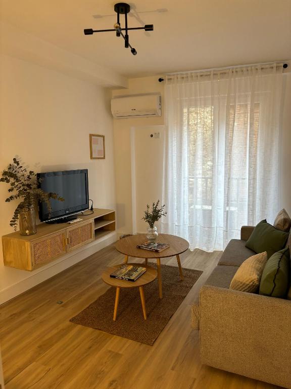 TV a/nebo společenská místnost v ubytování Victrix Homes