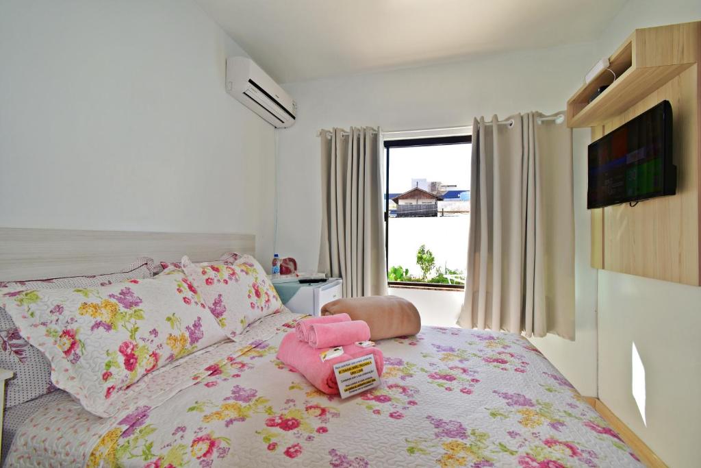 Cama ou camas em um quarto em Pousada Enseada dos Golfinhos