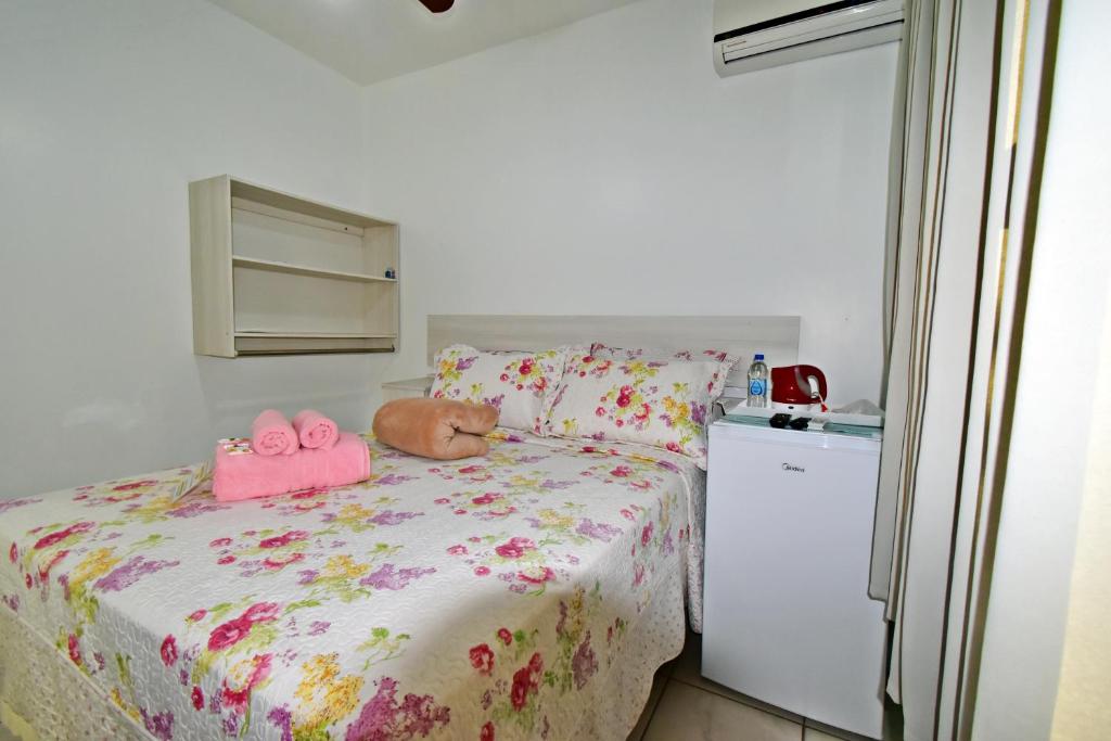 Cama ou camas em um quarto em Pousada Enseada dos Golfinhos