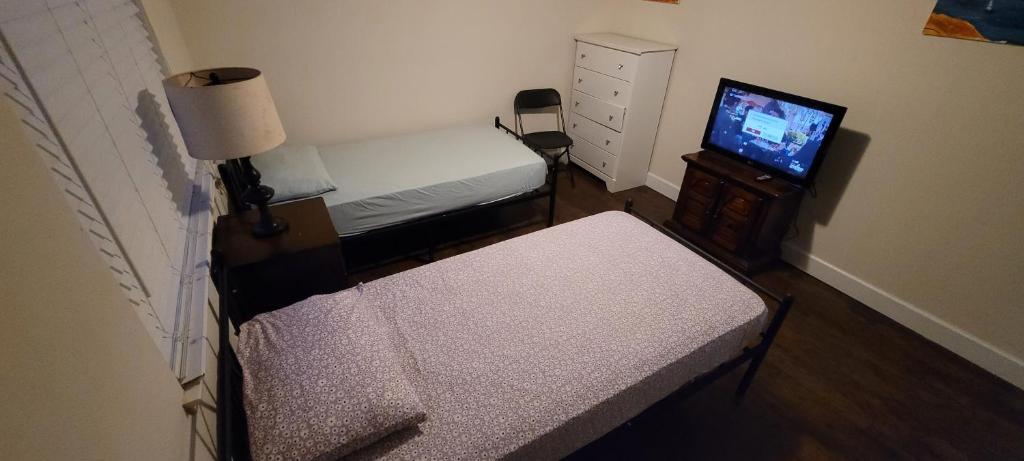 Postel nebo postele na pokoji v ubytování Treasure Home