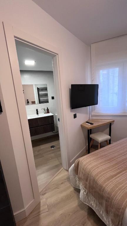 TV a/nebo společenská místnost v ubytování Victrix Homes