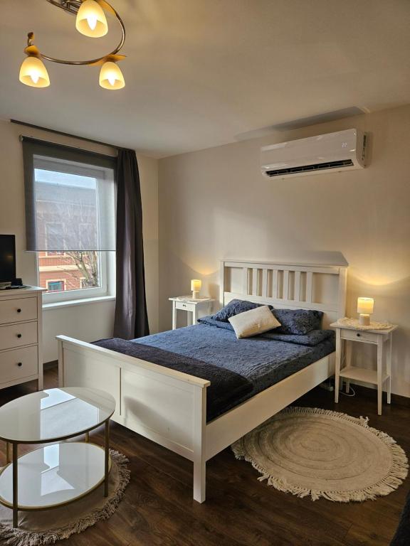 En eller flere senge i et værelse på L' - city' Reina' apartments'